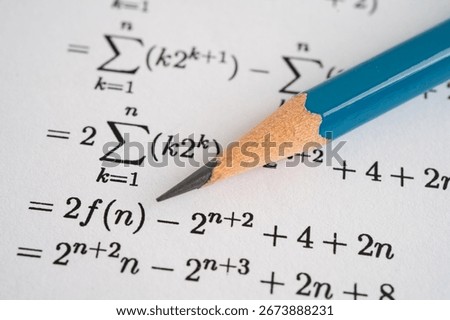 Pencil on mathematic formula exercise test paper in education school.