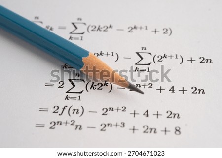 Pencil on mathematic formula exercise test paper in education school.