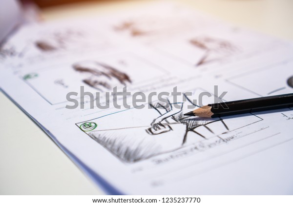 Pencil on Storyboard movie video layout for\
pre-production, storytelling drawing creative for process\
production media films. Script editors and writing graphic in form\
displayed in maker\
shooting