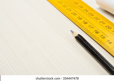 Pencil and ruler closeup on wooden Board. Copy-space. Top view - Shutterstock ID 334447478