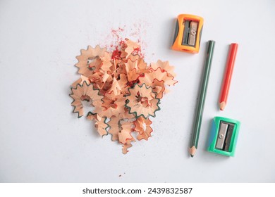 A pencil sharpener with a pencil and pencil shavings. - Powered by Shutterstock