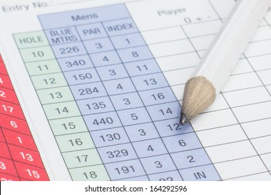 A Pencil Sitting On A Golf Score Card