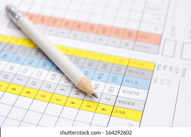 A Pencil Sitting On A Golf Score Card