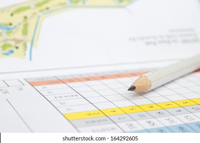 A Pencil Sitting On A Golf Score Card