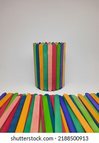 Pencil Stand Holder Made Of Colorful Ice Cream Sticks. School Craft Supplies And Materials, Children's Educational Facilities From Recycled Ice Cream Sticks. Selective Focus On A White Background.