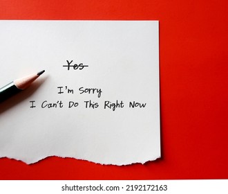 Pencil writing on torn note - I’m Sorry - I Can't Do This Right Now - concept of people pleaser learning to say no politely instead of say yes to make too much commitment