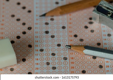 Pencils,, Eraser And Sharpener Under Standardized Test Form.selective Focus And Shallow Depth Of Field
Education And Exam Concept