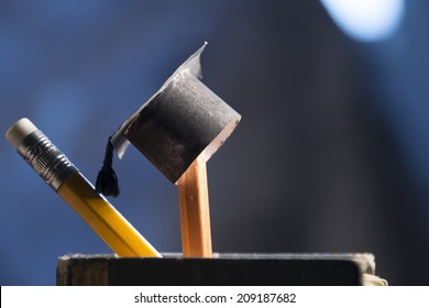 pencils and graduation hat, education concept - Shutterstock ID 209187682