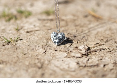 Pendant Best Friend Heart Necklace Shoot Outside In A Summer Day Closeup. Selective Focus