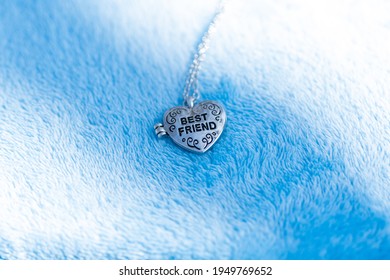 Pendant Best Friend Heart Necklace Shoot Outside In A Summer Day Closeup. Selective Focus