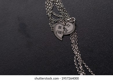 Pendant Of Best Friends Heart In Two Parts Necklace Closeup. Selective Focus