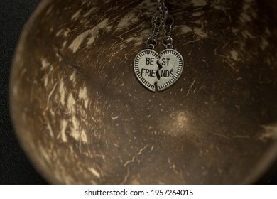 Pendant Of Best Friends Heart In Two Parts Necklace Closeup. Selective Focus