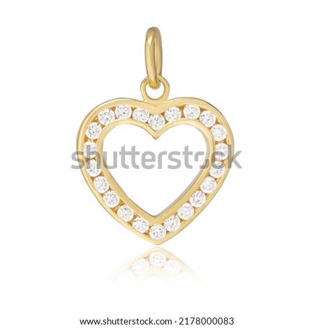 Pendant heart shaped with diamonds in white gold on a gray background with silver and zircons. Macro photo