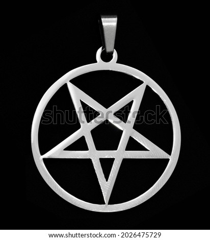 Pendant on the neck. Pentagram. Occult symbolism.