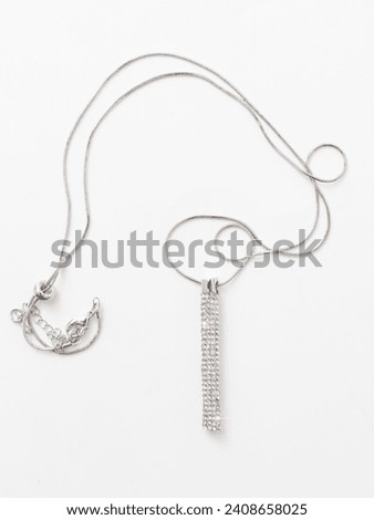 Pendant on a silver chain isolated on a white background.