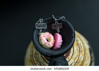 Pendant Set Of Best Friends Two Donuts Necklace Closeup. Selective Focus