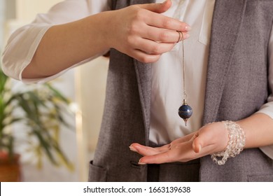 Pendulum In The Hands Of A Healer, Close-up