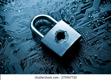 A penetrated lock security with a hole on computer circuit board background
