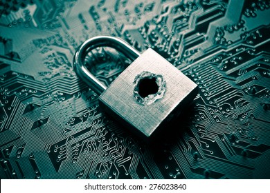 A penetrated security lock with a hole on computer circuit board background