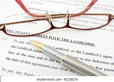 Pen,glasses And Tenant Agreement With The Landlord