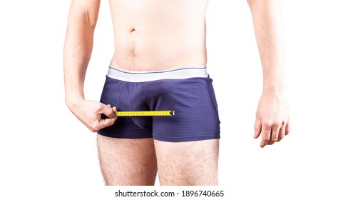 Penis size measure concept. Big erection. Man measures his penis in underwear. Erectile and potency concept.
