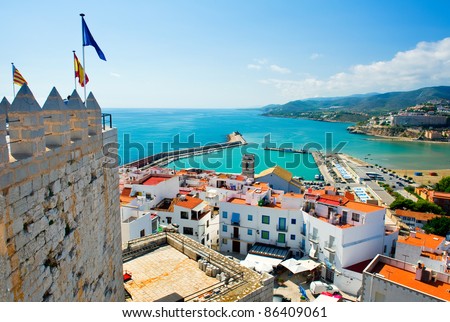 Peniscola port, view from castle Papa Luna, landmark of the city. Turquoise bay of Mediterranean Sea, bright, colours, sunny day. Popular travel destinations, touristic place.  Costa del Azahar, Spain