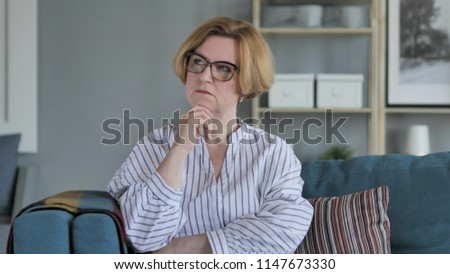 Penisve Thinking Sitting Senior Woman
