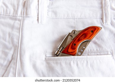 Penknife In White Pants Pocket.