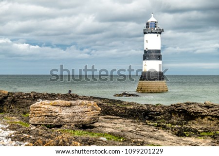 The Penmon point lighthouse is located close to Puffin Island on Anglesey, Wales - United Kingdom.