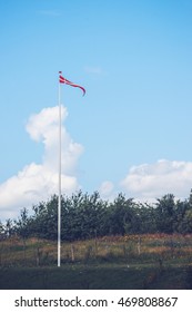 Pennant In Danish Colors On A Lawn In A Backyard