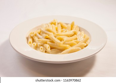 Penne Pasta With Alfredo Sauce In White Bowl