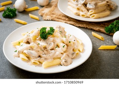 penne pasta carbonara cream sauce with mushroom - Italian food style - Powered by Shutterstock