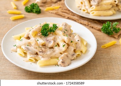 penne pasta carbonara cream sauce with mushroom - Italian food style - Shutterstock ID 1724358589