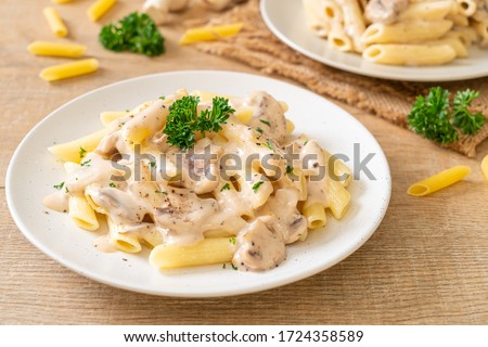 penne pasta carbonara cream sauce with mushroom - Italian food style