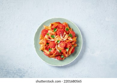 Penne Pasta With Chicken, Tomato Sauce And Parsley Leaves, Overhead Flat Lay Shot