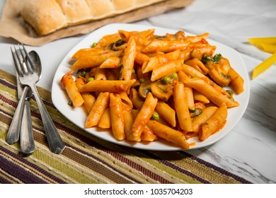 Penne Pasta In Creamy Vodka Tomato Sauce With Mushrooms Peas And Spinach