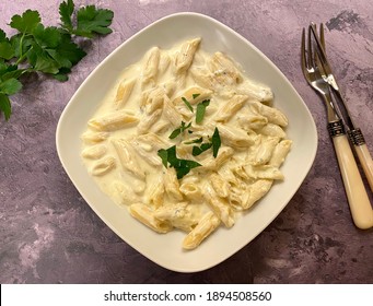 Penne rigate pasta with four types of cheese, also known as 