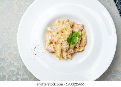 Penne With Salmon On White Plate