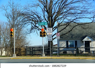 Pennsburg,Pennsylvania, U.S.A - November 26, 2020 - The Traffic Light On Main Street In Front Of A Residential Home