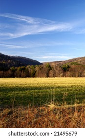 Pennsylvania Hay Field With Mountains In The Background.