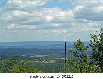 Pennsylvania mountain view with trees in the foreground and sky and clouds
