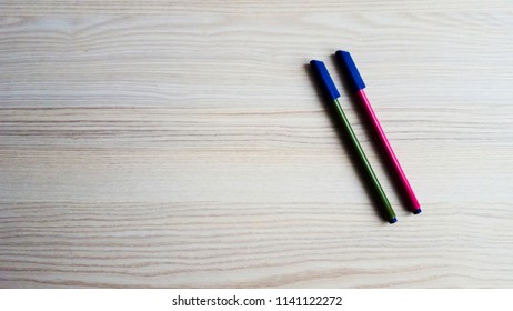 Pens on a table