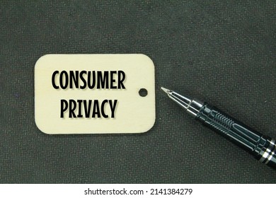 Pens And Wooden Tags With The Words Consumer Privacy