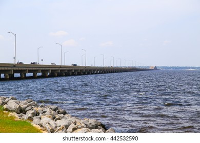 PENSACOLA BEACH, USA - MAY 13, 2015: View Of The Pensacola Beach Bridge Crossing The Santa Rosa Sound Towards Gulf Breeze With Plenty Of Cars Driving On The Bridge.