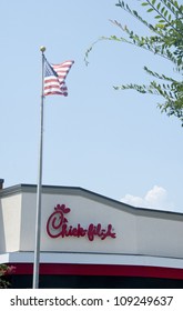 PENSACOLA, FL - AUGUST 1: American flag flies over Chick-Fil-A  in Pensacola, FL, on August 1, 2012 on national Day of Support following backlash from the owner supporting traditional marriage.