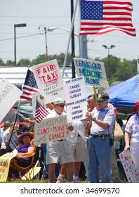 PENSACOLA, FLORIDA - JULY 4: Tea Party Attendees Gather As Part Of Nationwide Rallies To Protest Government Spending And Waste On July 4, 2009 In Pensacola, Florida.