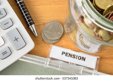 Pension File With Calculator, Pen, Coins And Glass Jar