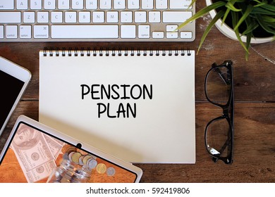 Pension Plan Concept With Smartphone, Keyboard, Glasses, Keyboard On Wooden Table