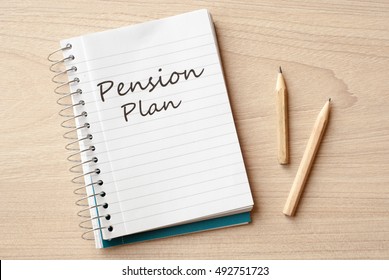 pension plan on notebook on desk