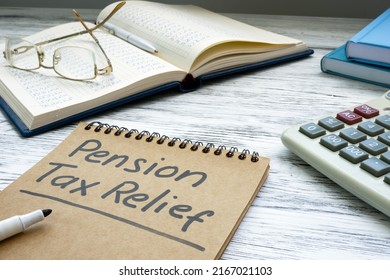 Pension Tax Relief Sign And Notepads On The Desk.